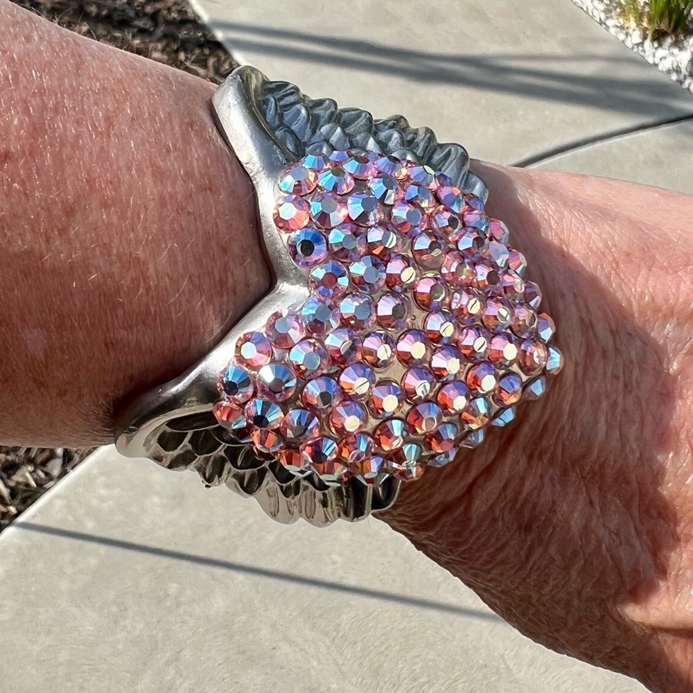 Gorgeous bracelet with crystal heart and wings. New without tags.